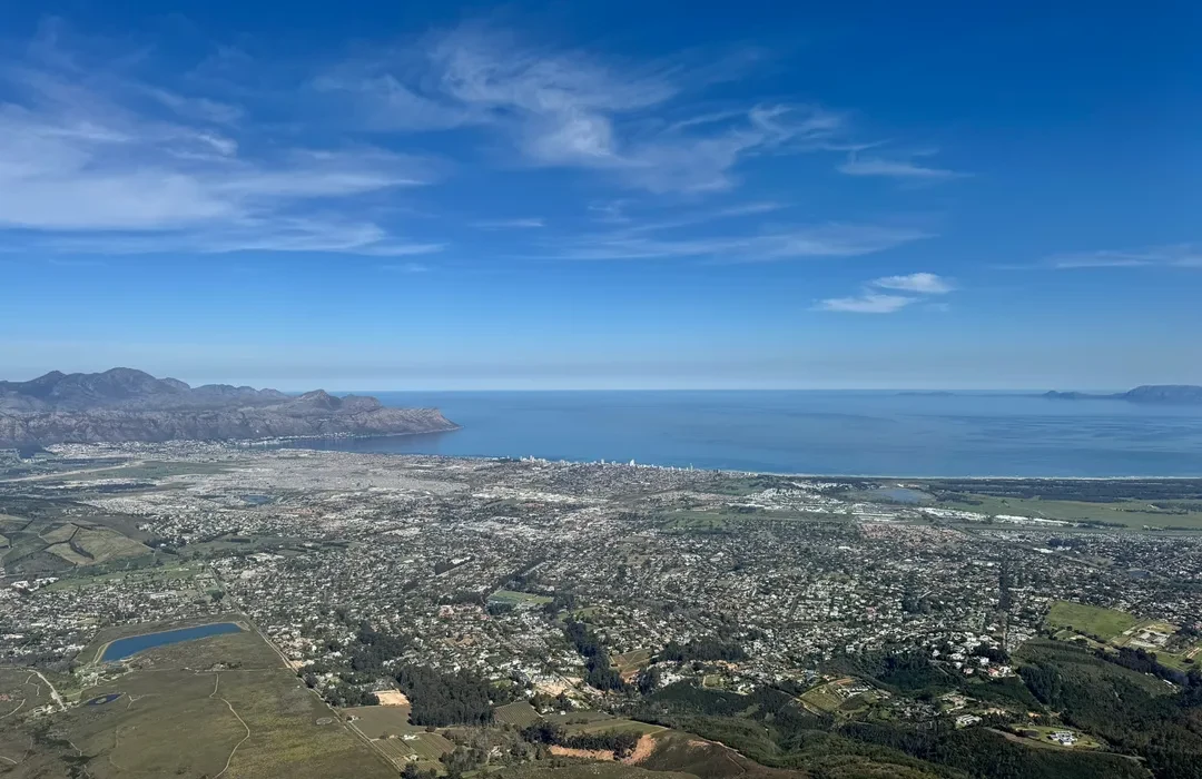 Aerial view over the Helderberg suburbs and coastline, looking out across False Bay