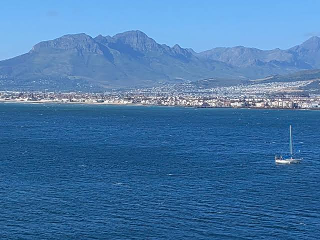 The Helderberg basin seen across False Bay, with the mountains rising behind Somerset West, Strand and Gordon's Bay